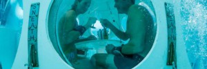 Belgians Florence Lutje Spelberg and Nicolas Mouchart drink champagne while sitting inside "The Pearl", a spheric dining room placed 5 metres underwater in the NEMO33 diving center, one of the world's deepest pools (33 metre/36 yards) built to train professional divers, before enjoying a meal inside, in Brussels, Belgium January 30, 2017. Picture taken January 30, 2017   REUTERS/Yves Herman